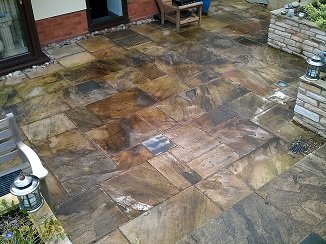 Photo of dirty patio stones before cleaning and sealing