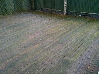 Photo of decking that needs cleaning.